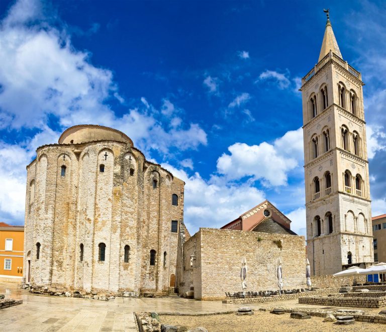 round church and church tower made of white stone